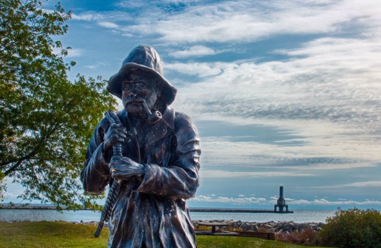 Fisherman statue and lighthouse, Port Washington, Wisconsin